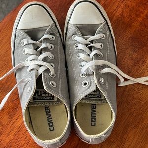 Gray converse.  Worn but still in good shape. Size 7